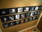 Wall of framed black and white art